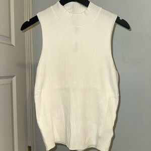 The drop sleeveless ribbed knit turtleneck top